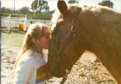 palomino horse with child